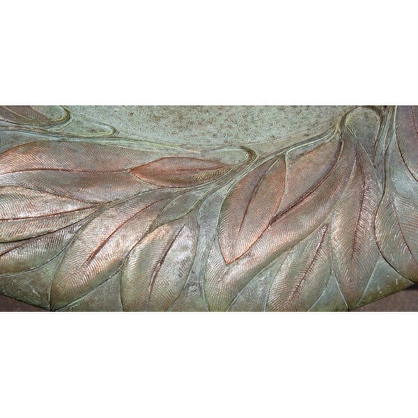 Detail of the leaf fountain motif round garden water bubbling sculpture